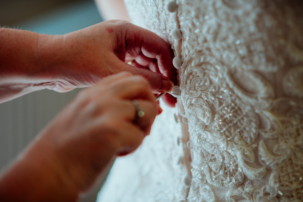 Kent wedding photographer The Ferry House Inn Harty Creative wedding Magical themed wedding DIY wedding crafts book themed Harry Potter Lord of the Rings wedding dress buttons