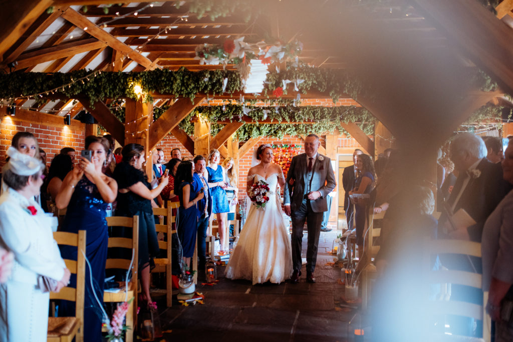 Kent wedding photographer The Ferry House Inn Harty Creative wedding Magical themed wedding DIY wedding crafts book themed Harry Potter Lord of the Rings wedding dress walking down the aisle