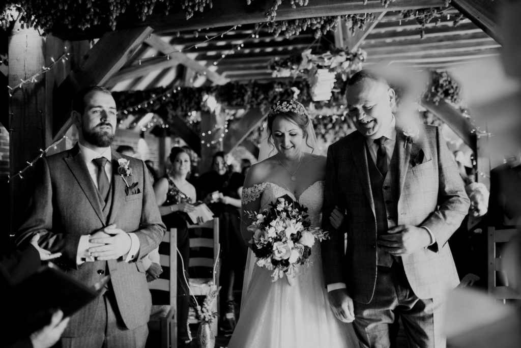 Kent wedding photographer The Ferry House Inn Harty Creative wedding Magical themed wedding DIY wedding crafts book themed Harry Potter Lord of the Rings wedding dress walking down the aisle