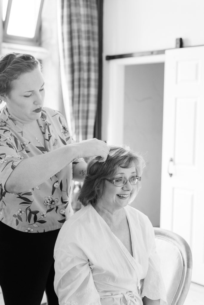 Mother of the bride having her hair styled