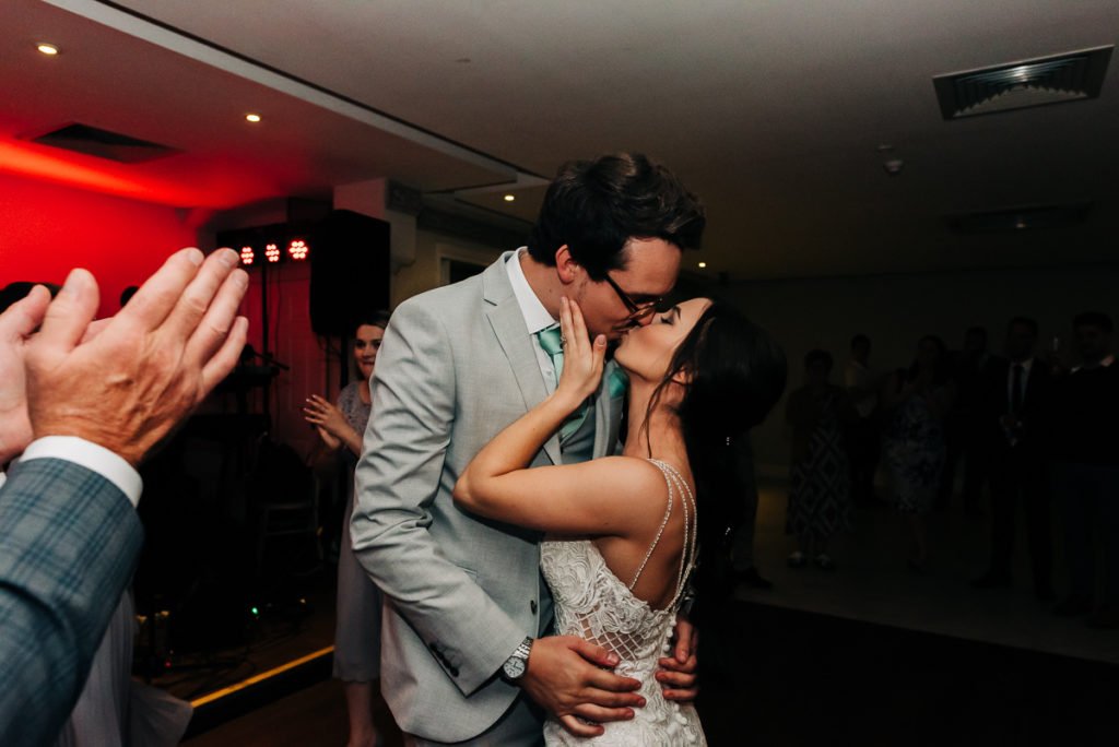 Bride and groom kiss on the dancefloor