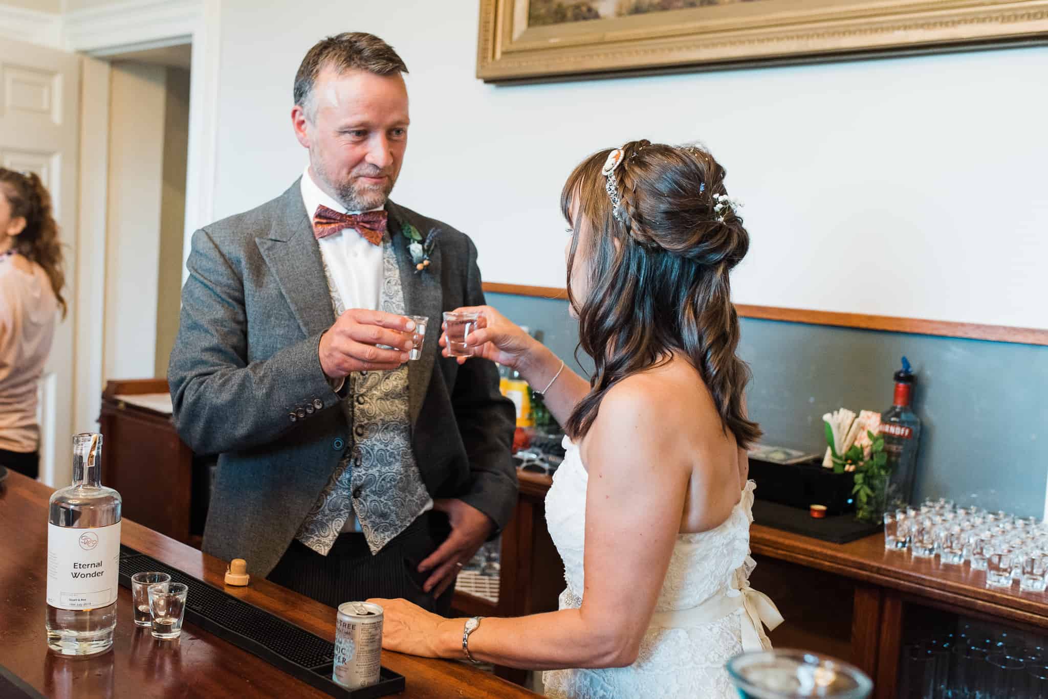 Bride and groom do a shot to get the party started