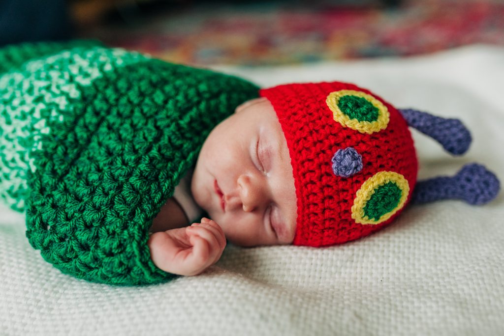 newborn baby in a hungry caterpiller costume
