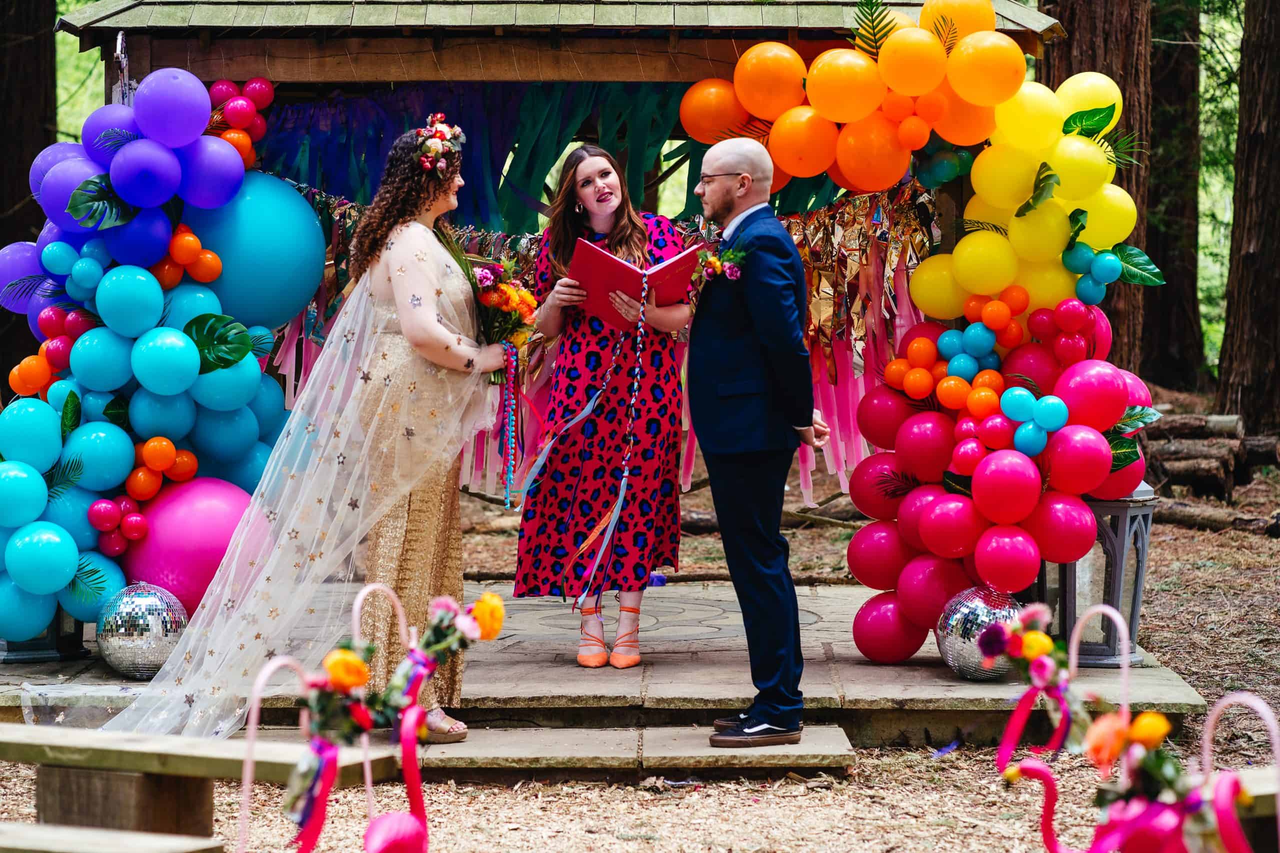 A fun and colourful wedding day outdoor ceremony