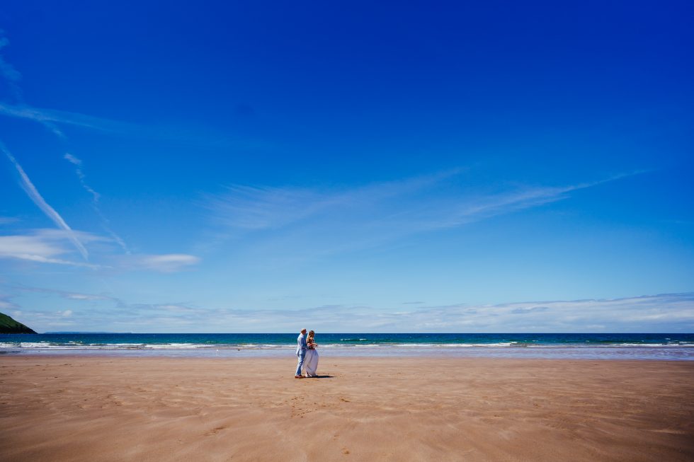 Couple on the beach during their wedding in Somerset