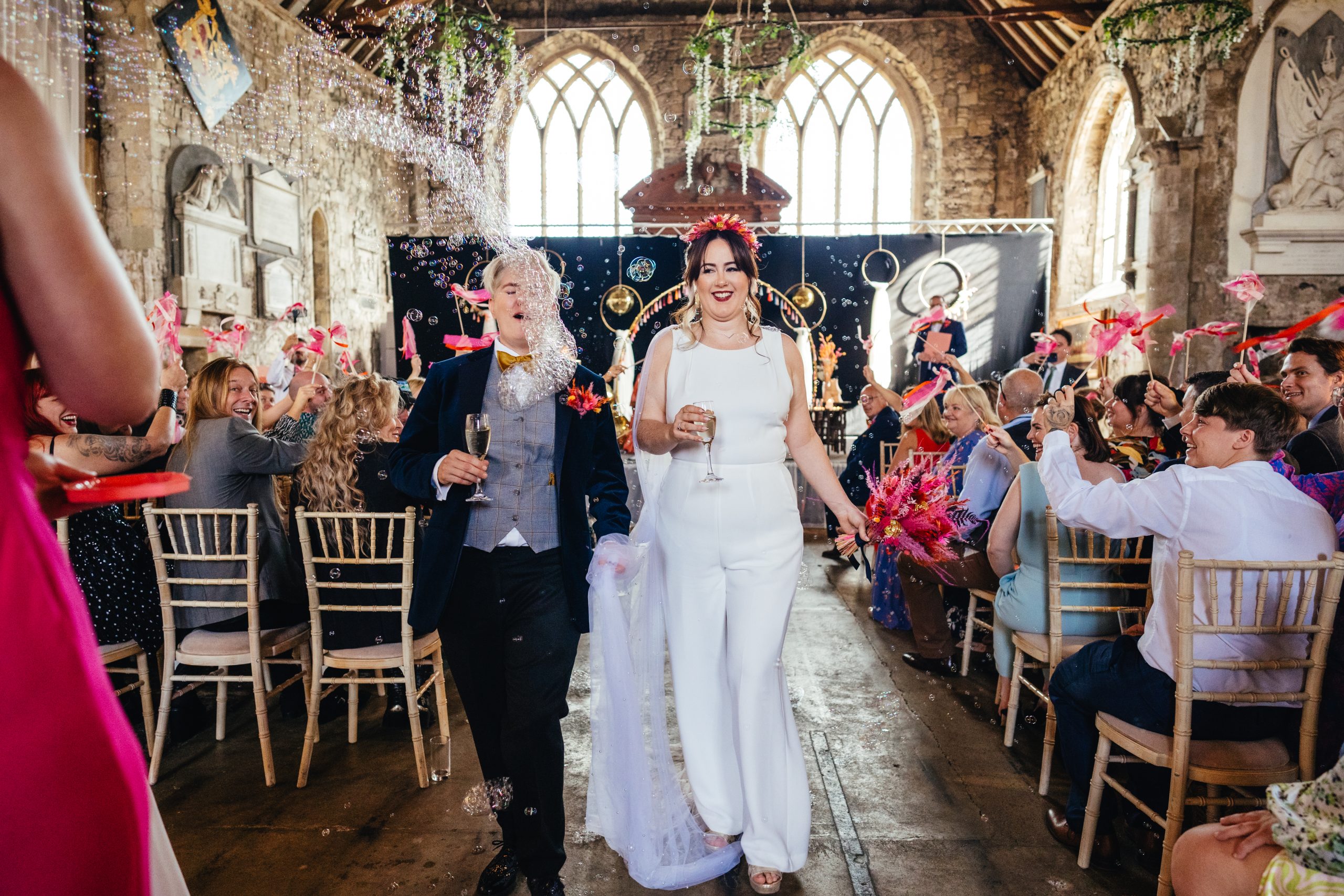 Fun Devon wedding photography colourful wedding bubble confetti line