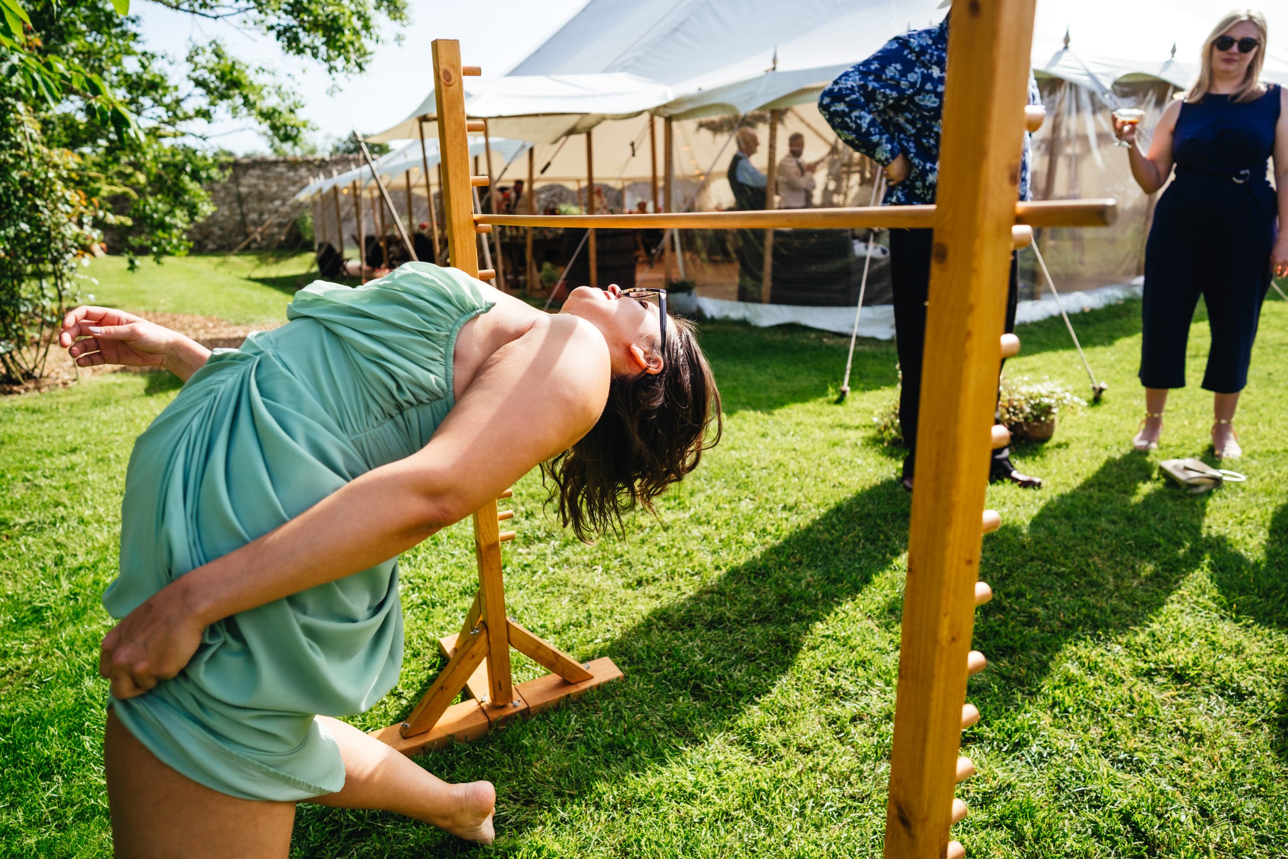 Wedding guests play garden games at Uphill Farm
