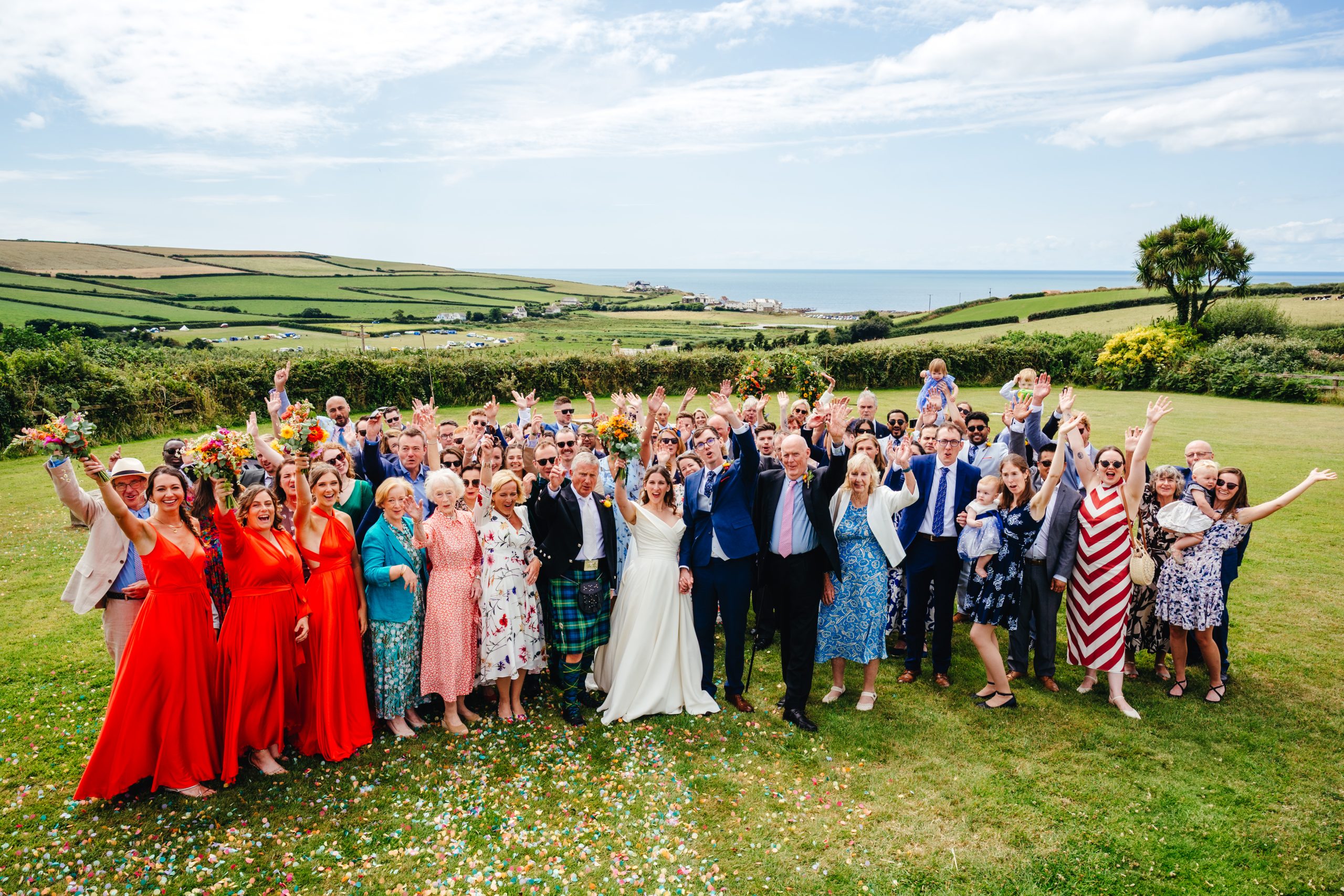 Wedding party celebrate with a Devon coastal view at the Barn at South Milton